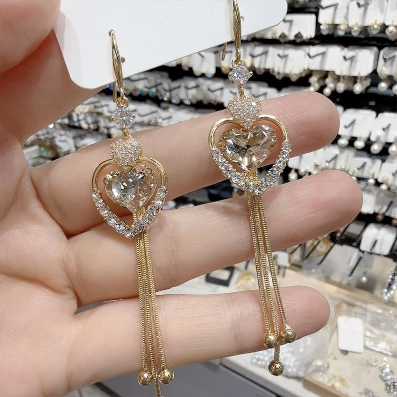 ✨ Elegantes pendientes con borlas en forma de corazón-ES